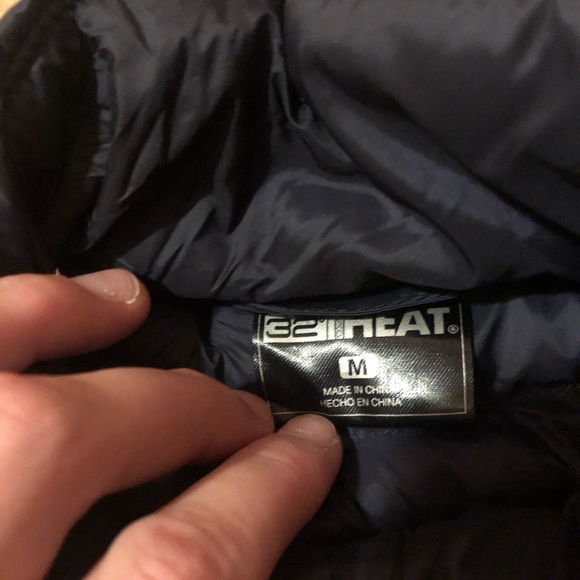 Navy blue puffy jacket with black details. - Picture 3 of 3